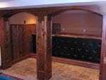 Custom Bar Area With Cedar Arches, Wainscot, And Tile Floors